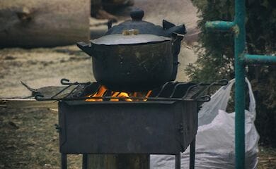 Residents of Slavutych cook food on a fire