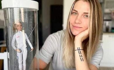 Olympic fencing champion Olga Kharlan has put her personalised Barbie doll up for charity auction