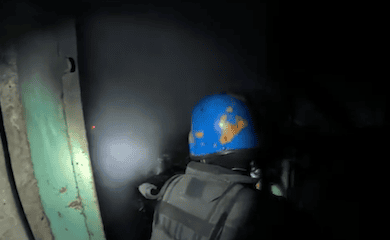 Rescuers put out a fire under enemy shelling