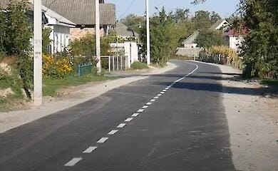 In Chernihivshchyna, the mother of a fallen Hero paved the road on the street named after her son at her own expense