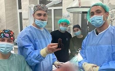 In a front-line hospital, medics removed a mine tail from a soldier's leg