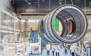 Technicians at Thales Alenia Space's industrial facility in Turin, Italy, guide the Gateway HALO module to the stress test site.