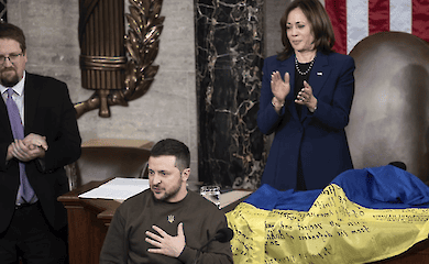 Vladimir Zelensky (centre) reacts while Kamala Harris (back left) and Nancy Pelosi applauds