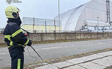 Fire continues at Chernobyl nuclear power plant after impact on unit shelter