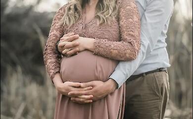 A man and a pregnant woman expecting a child