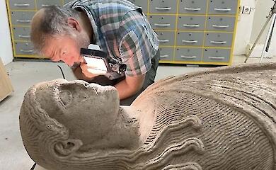 An almost intact 2,500-year-old statue has been discovered beneath an ancient road in Turkey
