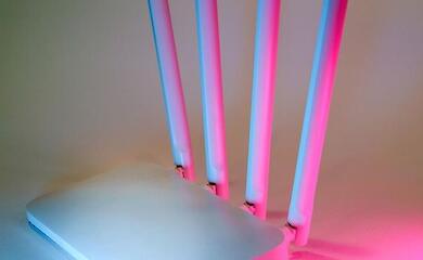 A home wireless router with four antennas and no visible branding.